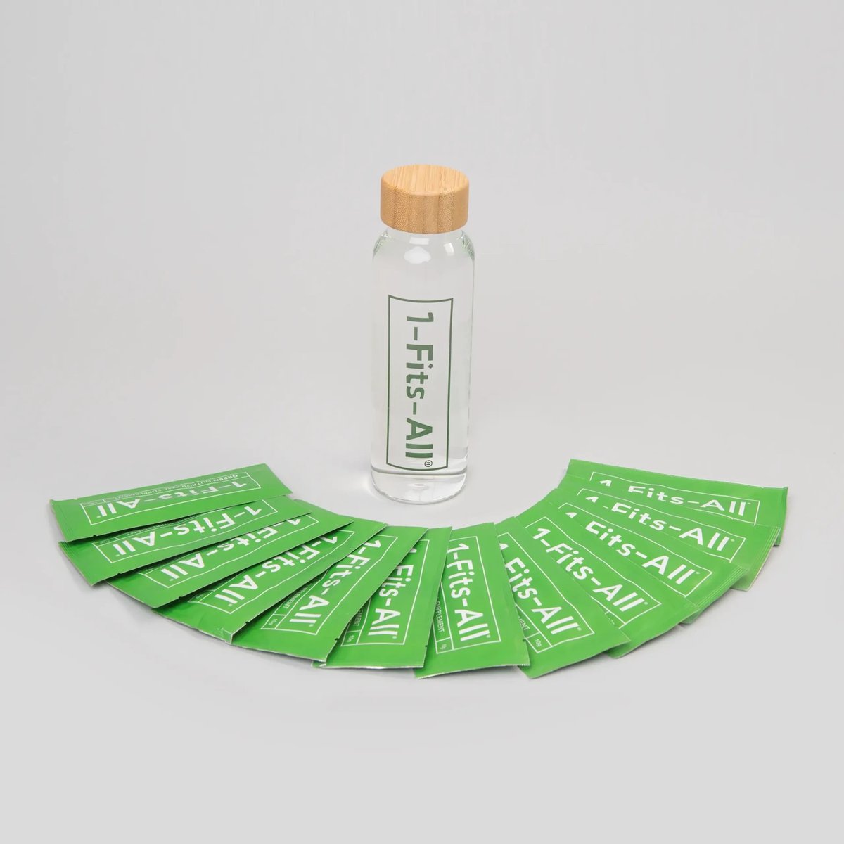1-Fits-All product bottle and green sachets